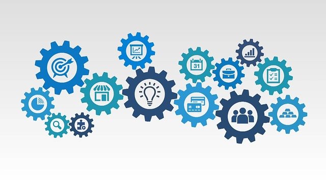 Blue interlocking gears with business icons illustrating automated document processing workflows
